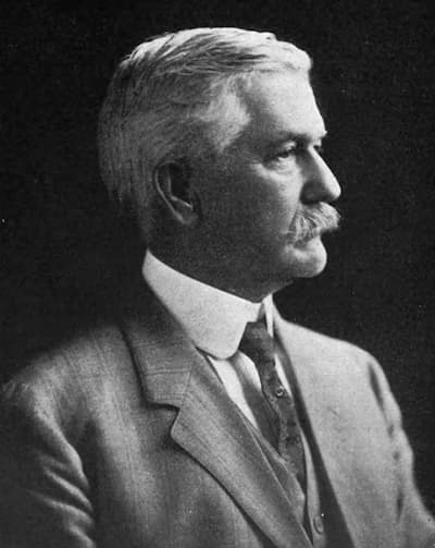 Dr. William Gorgas in a portrait photograph when he was in his 50s or 60s. He has a tidy moustache and distinguished white hair.