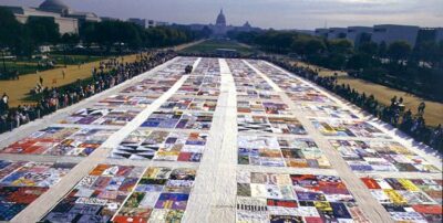 This shows the immense size of the AIDS quilt that stretches for blocks and blocks. The photograph is in color and  from above, so it's difficult to see much detail, but you do get a feeling for the expanse of the quilt.