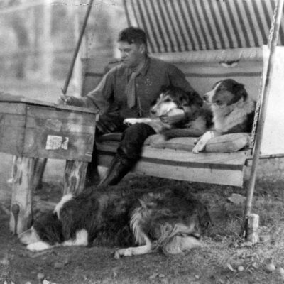 Terhune with dogs on swing