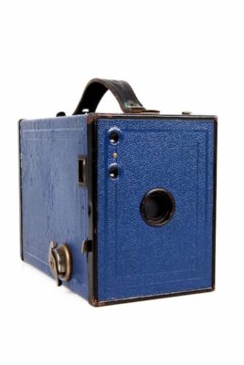 This is a photo of an early Brownie in a navy blue color and the box-like design.