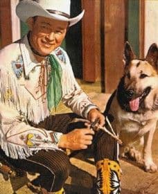Color press photograph of Roy Rogers and his German shepherd, Bullet.