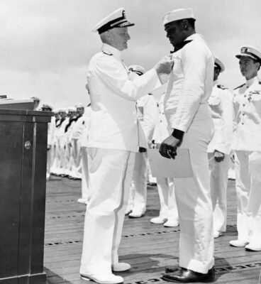 Dorie Miller receiving Naval Cross from Admiral Nimitz
