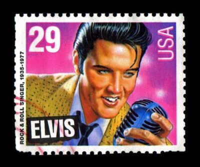 This is a 29 cent stamp depicting Elvis Presley holdin a microphone.  