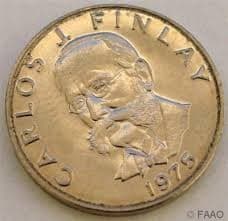 A contemporary photo of a gold coin with Dr. Finlay's name and face embossed on it.