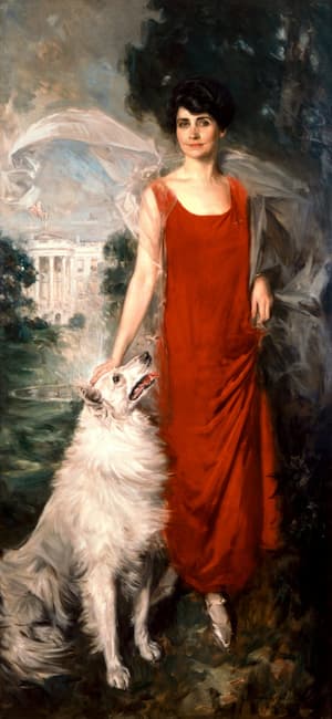 A stunning portrait of Grace Coolidge hat hung in the China Room. She wear a long red sheath dress and either Prudence Prim or Rob Roy sit beside her.