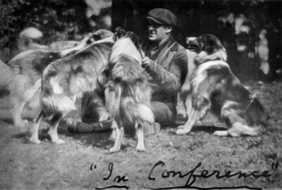 Terhune has labeled this black-and-white photo of himself sitting in the midst of five or six collies: "In conference." For Terhune, the best kind of business meeting of all.