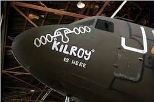 "Kilroy is Here" painted on the nose of a WWII plane.