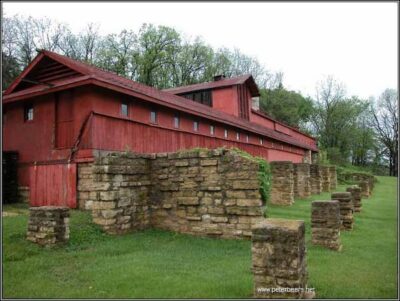 A color photograph of the red Midway Barn at Taliesin