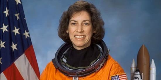 Color photo of Ellen Ochoa in her astronaut's suit.