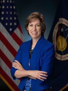 Press photograph of Ellen Ochoa in a blue dress. 