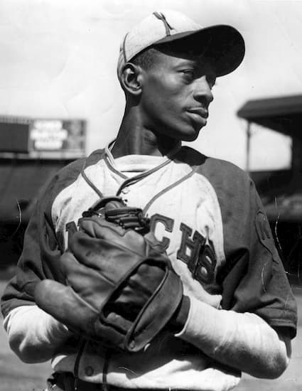 Satchel Paige pitches for A's at age 59