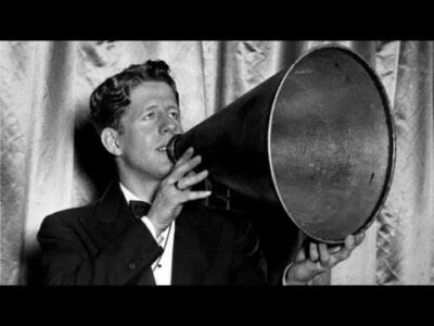 The photo is of a young Rudy Vallee using his megaphone to perform.