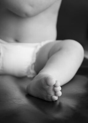 stock photograph of baby's leg showing how disposable diapers can prevent leakage