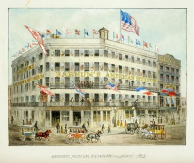 This is likely a color postcard of The American Museum, as Barnum called his "dime museum." Flags fly across the roof and lettering and animals are painted all over the sides of the building.