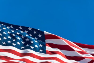 this is waving American flag with blue sky beyond, hopefully ushering in better times. The photo is istock, credit ramberg.