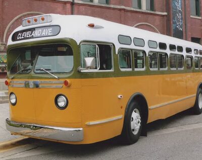This is a color photo of the Cleveland (avenue) bus on which Rosa Parks was arrested. It is a typical city bus from the 1950s--white on top and orange on bottom...