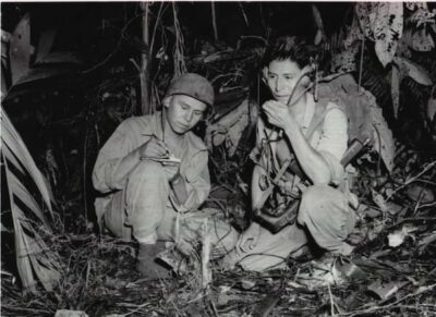 black and white photo of code talkers at work during battle at Guadalcanal.
