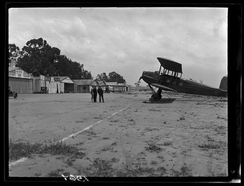 Photo of a plane on a rural airfield
