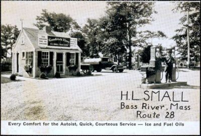 This is a postcard from ass River, Massachusetts, showing how early gas stations sometimes built their pumps far from the store.