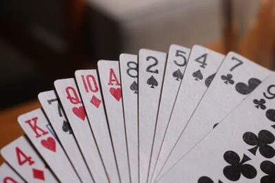 A photograph showing a mixed hand of cards. 
istockphoto credit shalstack