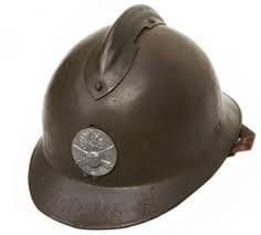 Because the Harlem Hellfighters fought alongside the French military, they  wore the French helmets and used French weaponry. 
