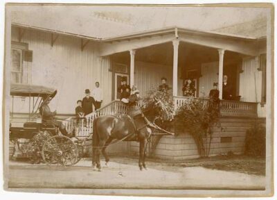This is a black-and-white photo of Benamin Harrison and his grandchildren in Palo Alto, California. He stayed at this home when he lectured at Stanford.
