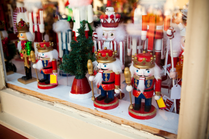 Window display featuring Christmas nutcrackers of all sizes and shapes.
