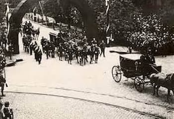 A black and white photo of McKinley's funeral in Washington. There are at least 3 carriages pulled by horses, along with many men walking along beside the hearse carriage. Library of Congress