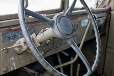 This shows that the inside of a Jimmy was bare bones. A simple oversized steering wheel and a few visible gears but nothing fancy.
