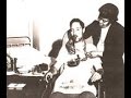 This is one of the few photos of Bessie Blount helping a patient with use of the feeding device. She stands behind the patient, but details are hard to make out.