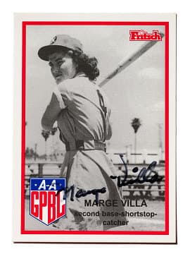 A basebeall card featuring Marge Villa at bat. She is in uniform, on thei field, and concentrating hard on the incoming ball.